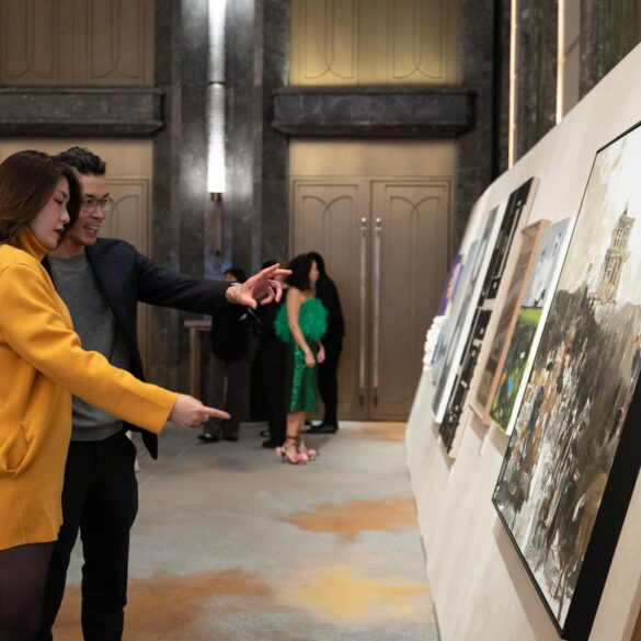 Guests engaging with contemporary artworks at Para Site’s 2025 Benefit Auction in Hong Kong, highlighting community connection and collector interest in emerging Asian artists.