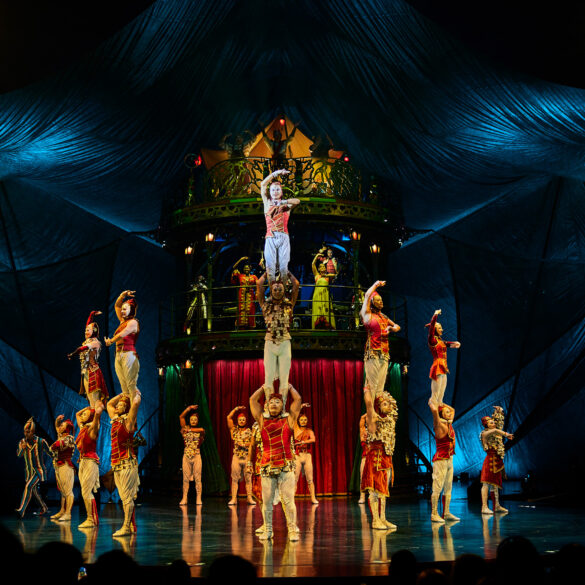 Cirque du Soleil KOOZA ensemble cast performing a vibrant circus scene on stage, blending acrobatics, theatre, and live music in Singapore.