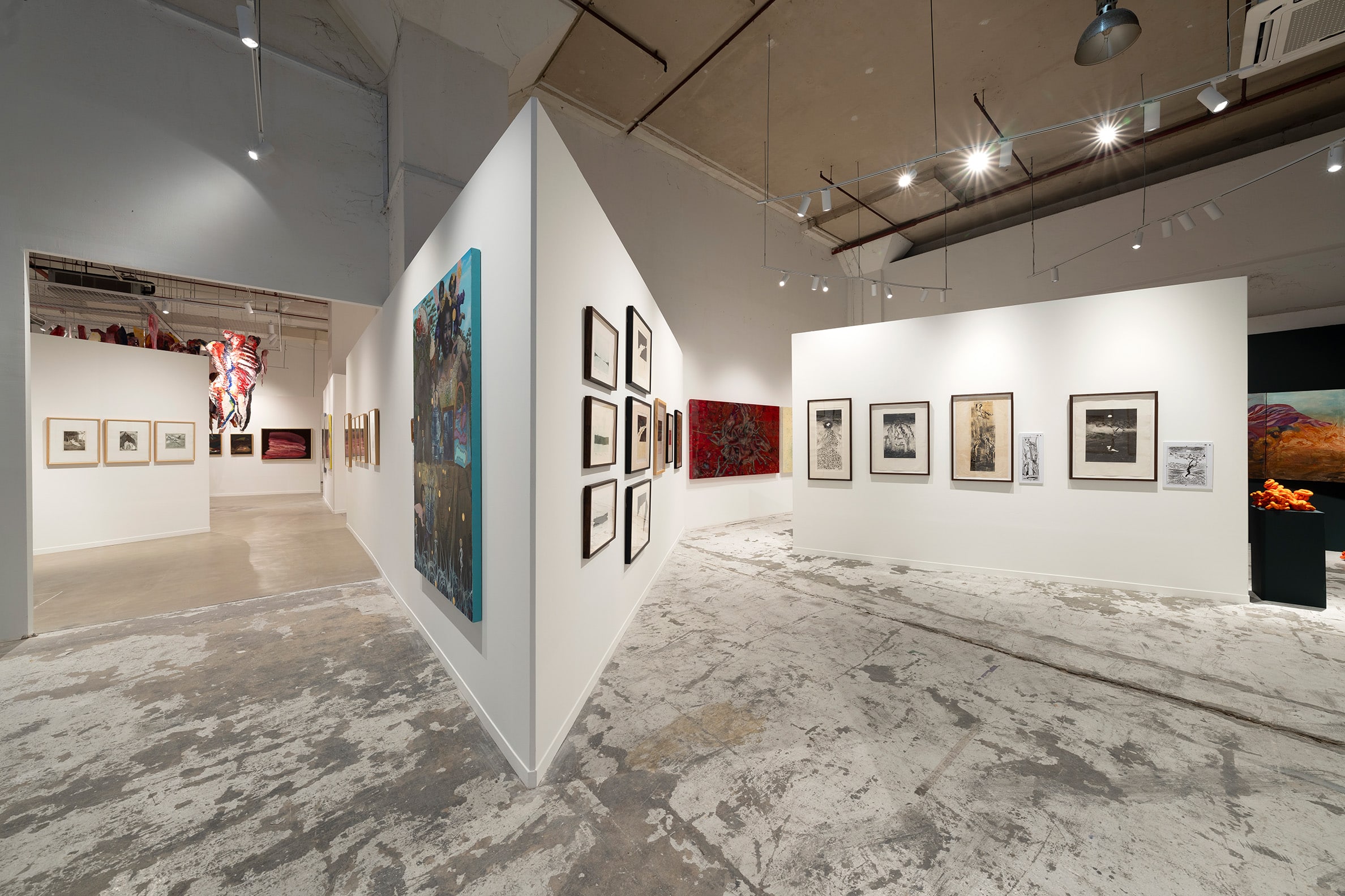 Interior view of S.E.A. Focus 2025 at Tanjong Pagar Distripark, featuring framed Southeast Asian contemporary artworks in a clean, minimalist gallery space.