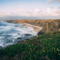 Dramatic cliffs and wild Atlantic coastline near Alentejo, Portugal, captured during golden hour — a breathtaking destination for road trippers.