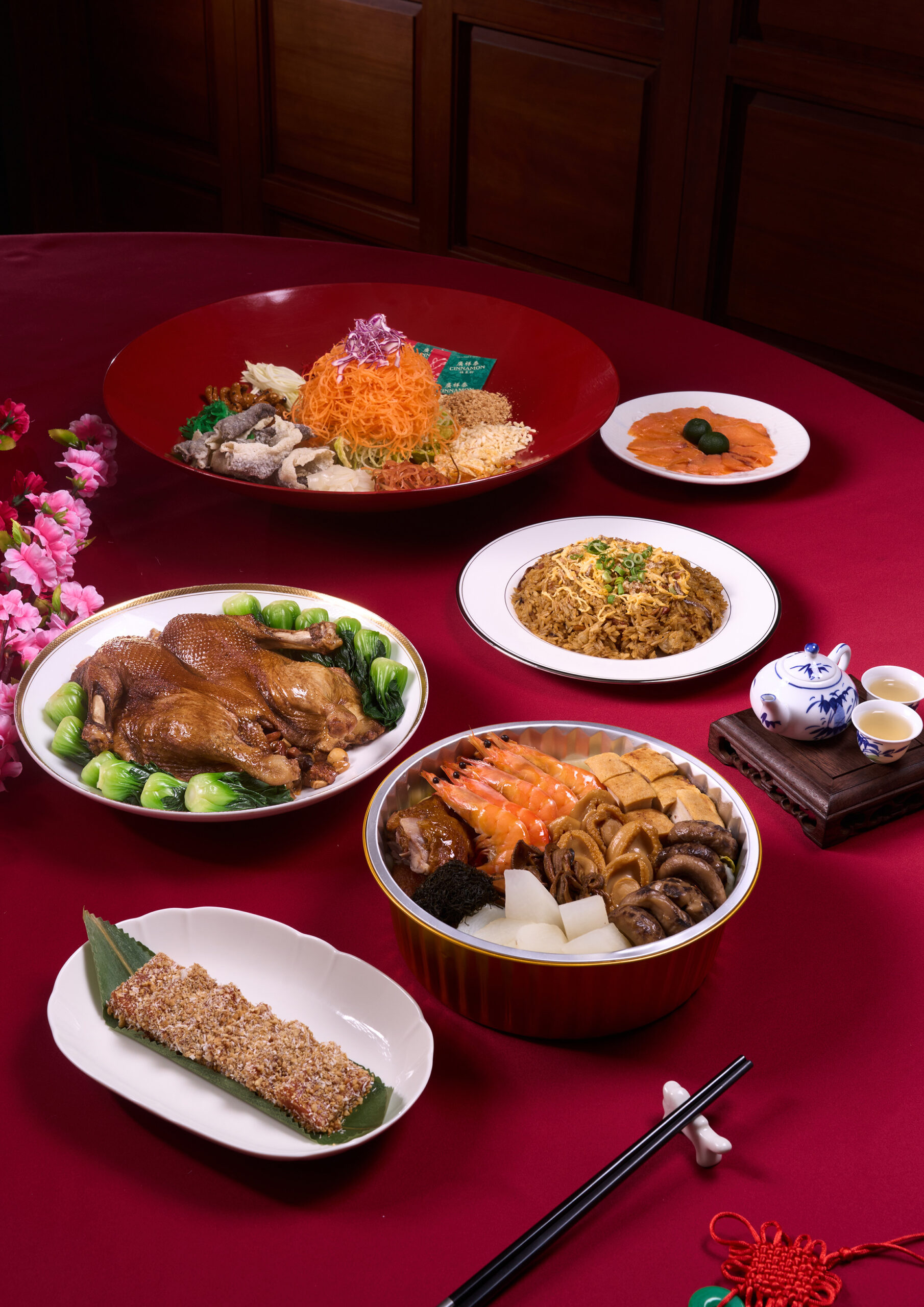 Tien Court Chinese New Year takeaway spread with yu sheng, pen cai, braised duck, prawns, glutinous rice, and traditional festive dishes