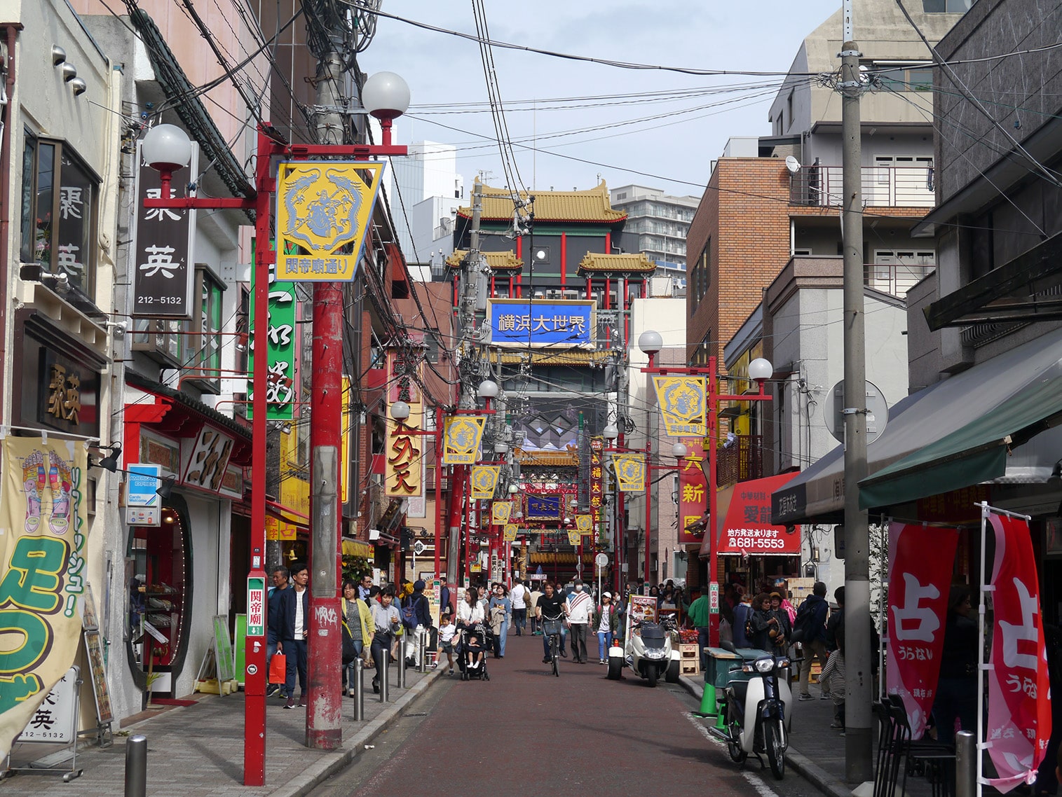 Yokohama Chinatown street scene with shops and lanterns.