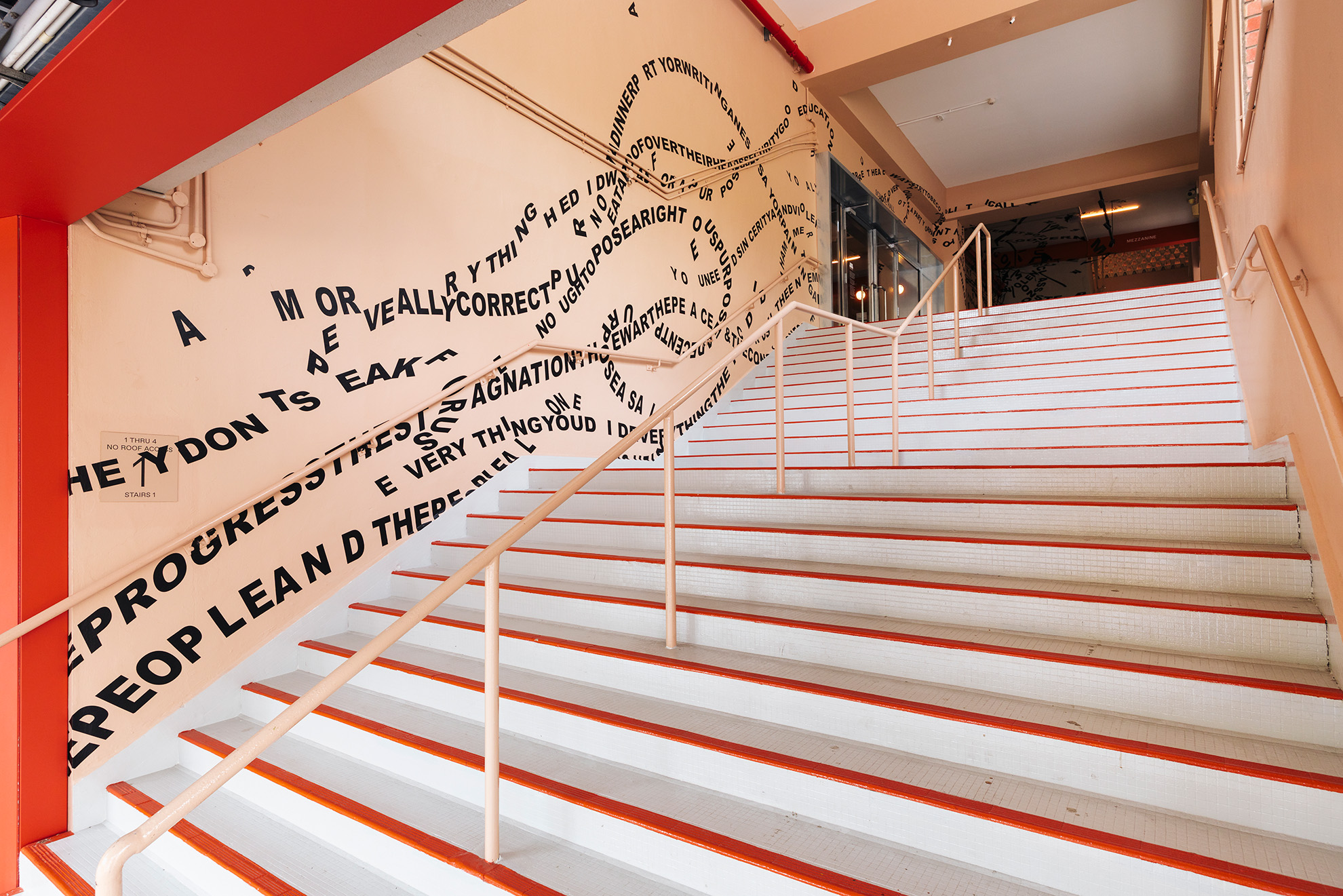 Exhibition space at Tanoto Art Foundation showing minimalist installation and architectural details.