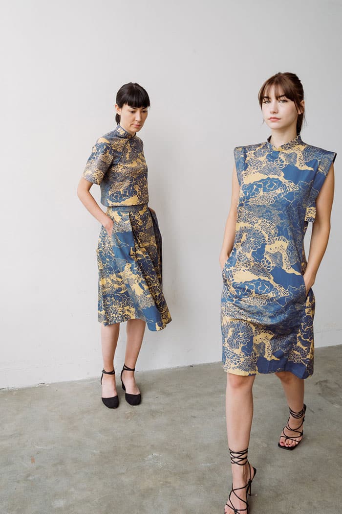 Models wearing blue and gold patterned dresses by A.Oei Studio showcasing modern silhouettes at Eco Fashion Weekend 2026 Singapore.
