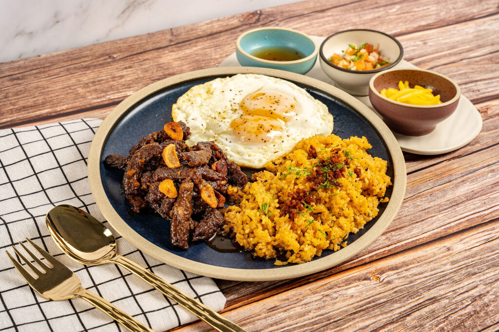 Filipino-style Angus beef tapa with garlic rice and sunny-side-up eggs at Mary Grace Singapore