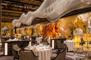 Palace Garden restaurant interior at Grand Lisboa Palace Macau with floral mural and chandelier