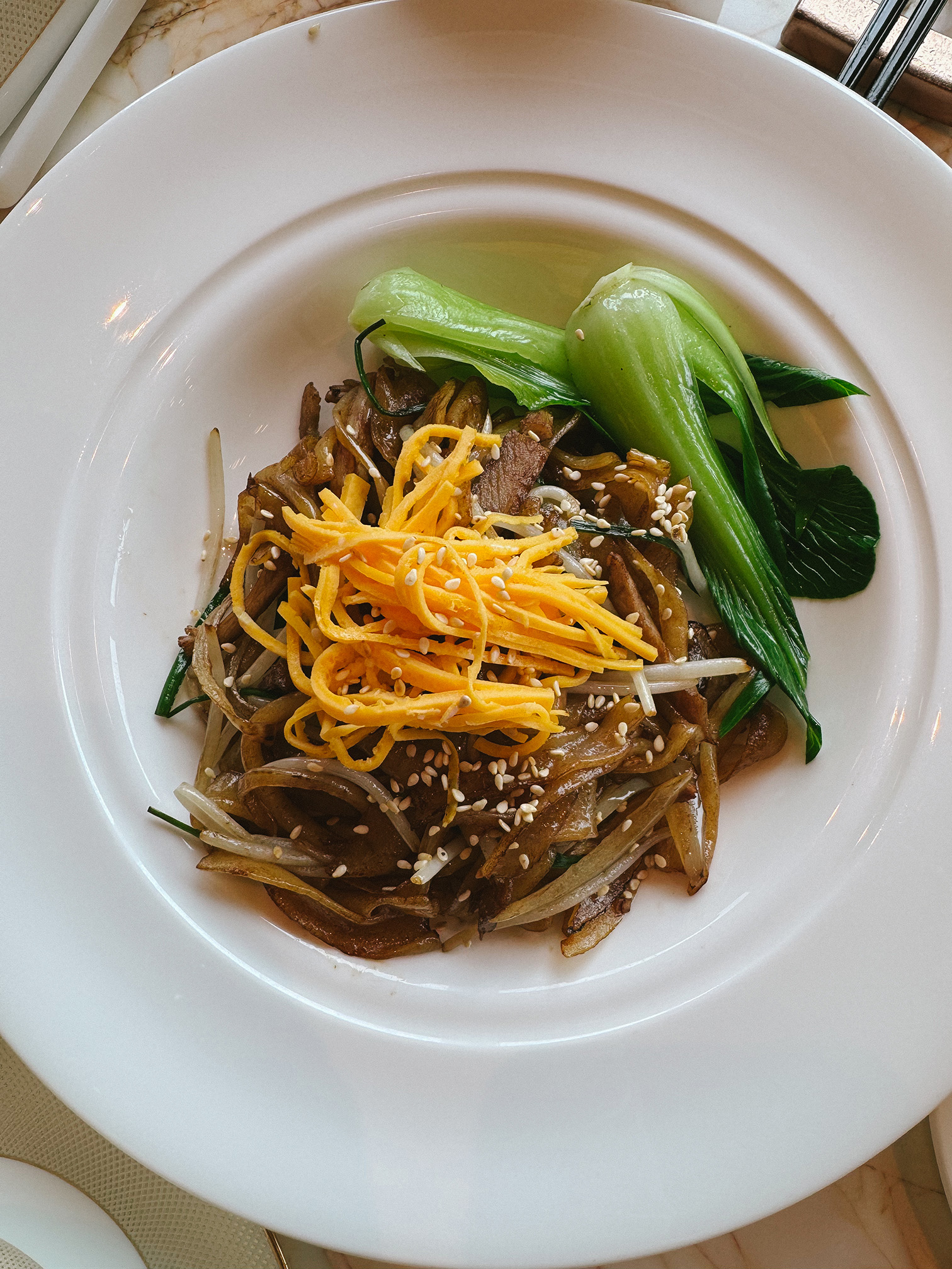 Wok-fried hor fun with shredded duck, bean sprouts and greens at Residence Eleven, Hilton Saigon