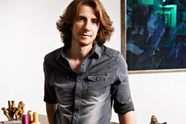 A photo of Robert Mercier, leather fashion designer at his artisan workshop.