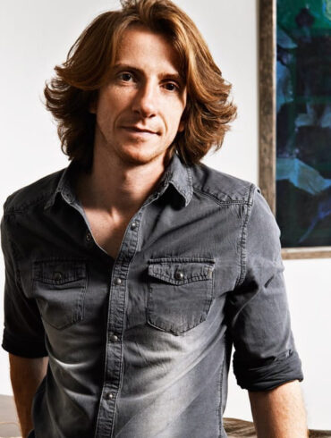 A photo of Robert Mercier, leather fashion designer at his artisan workshop.