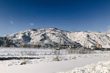 Snow-covered mountains and townscape of Yuzawa Onsen in Niigata, Japan’s Snow Country near Tokyo.