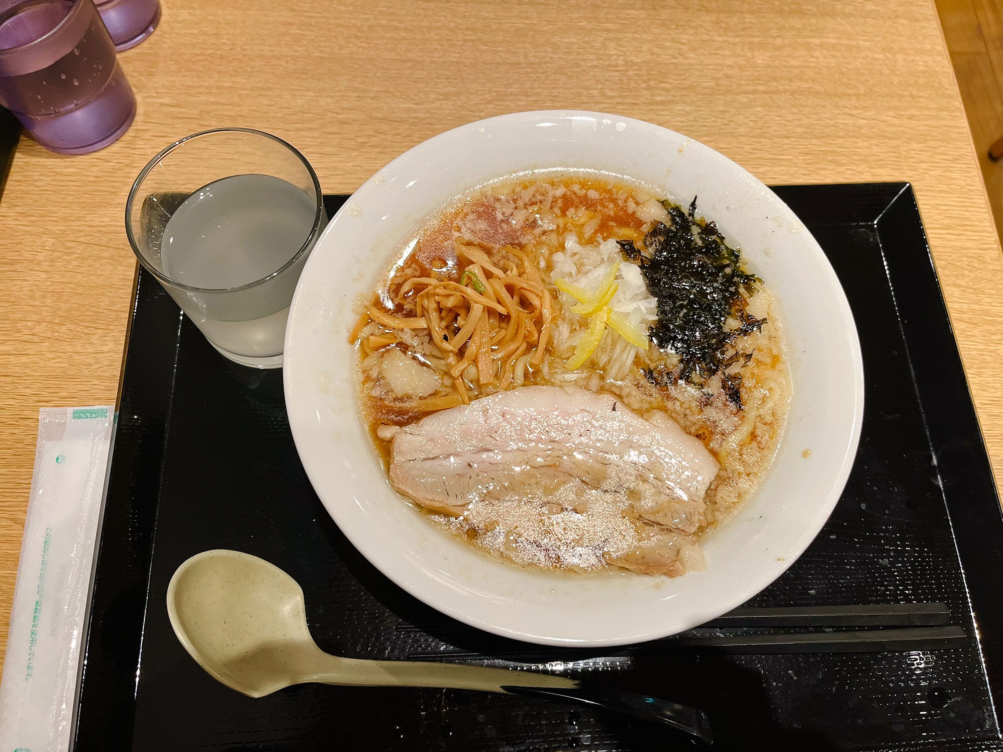Bowl of ramen served with sake in Yuzawa Onsen, Niigata, a region famous for food and sake.