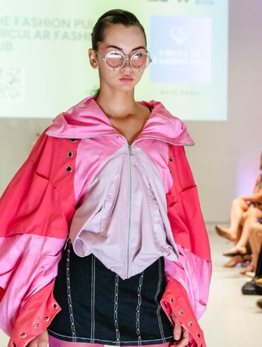 Model walking the runway for a sustainable fashion showcase at Eco Fashion Weekend Singapore 2025.