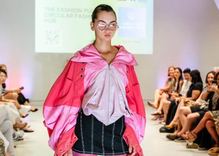 Model walking the runway for a sustainable fashion showcase at Eco Fashion Weekend Singapore 2025.