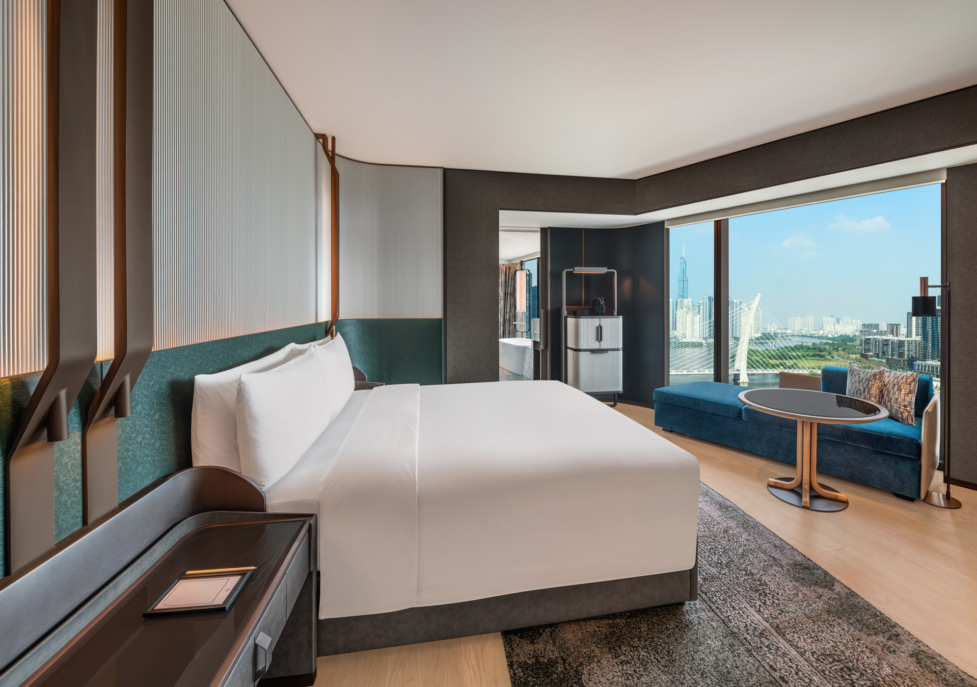 King Premium Corner Room bedroom with floor-to-ceiling windows and river view at Hilton Saigon