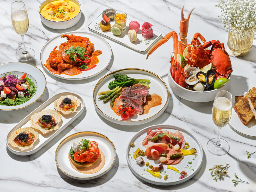 Overhead spread of Crossroads Buffet's Mother's Day brunch dishes including chilli crab, seafood on ice, scallops, cold cuts and champagne at Singapore Marriott Tang Plaza Hotel