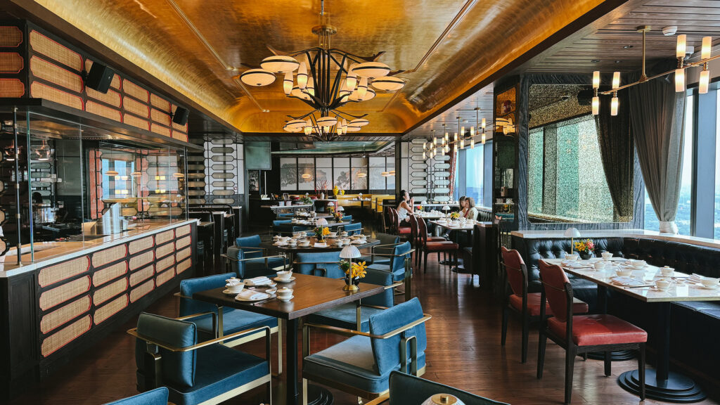 Dining room interior of Residence Eleven restaurant at Hilton Saigon with city views