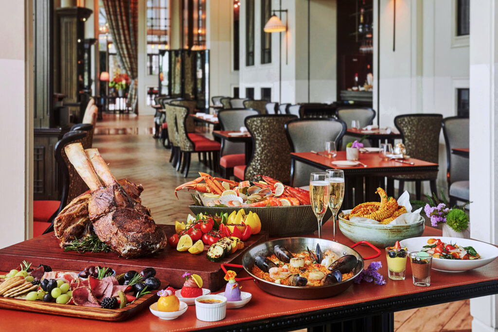 La Brasserie's Mother's Day brunch spread featuring a whole roasted tomahawk, seafood paella, cold cuts and champagne at The Fullerton Bay Hotel Singapore