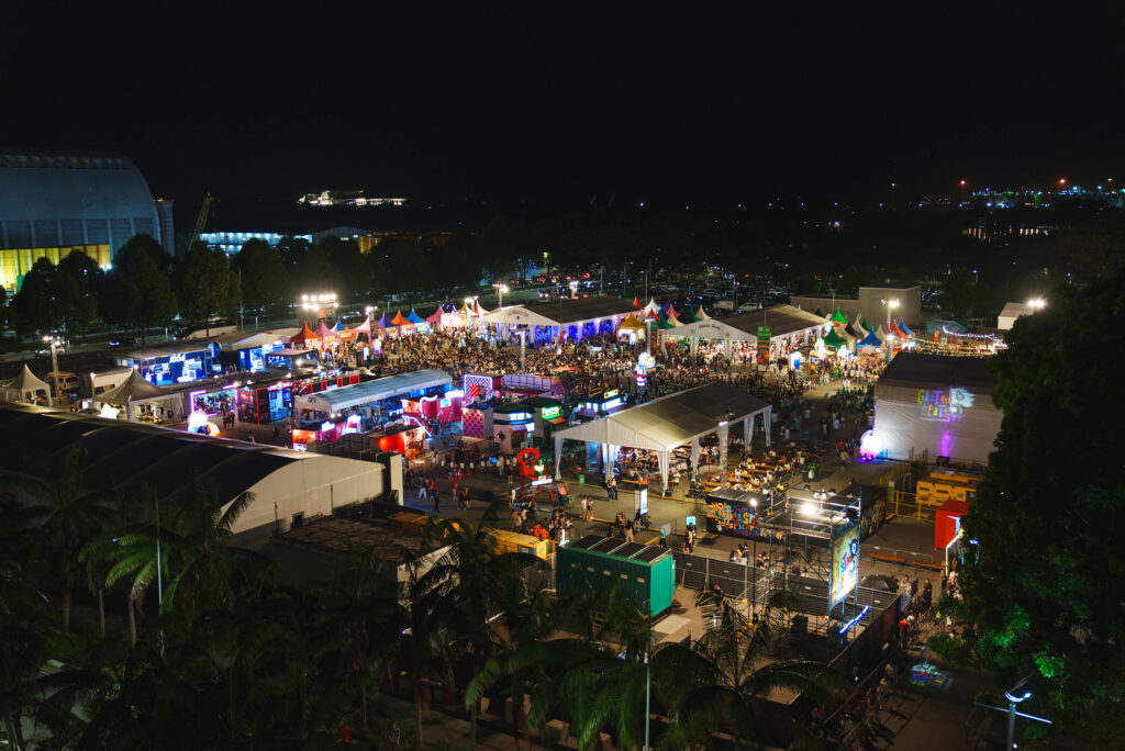 Aerial view of GastroBeats festival at Bayfront Event Space, Singapore, with crowds and food stalls lit up at night