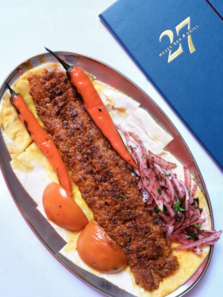 Adana kebab with grilled peppers and sumac onions at 27 Mezze & Grill, a Turkish fine dining restaurant in Singapore