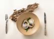 Oysters with caviar and edible flowers, a fine dining dish from Singapore's fine dining restaurant scene