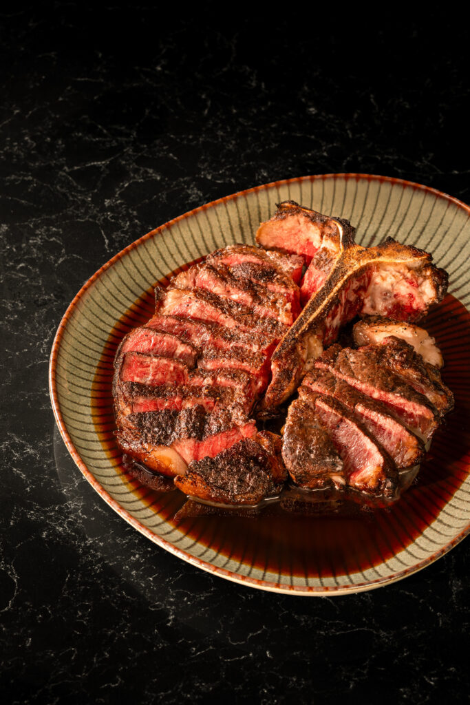 Sliced Wagyu beef steak served at VUE Bar & Grill, a rooftop fine dining restaurant in Singapore