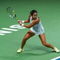 Alexandra Eala stretches for a backhand return during a match, credit: The Kallang