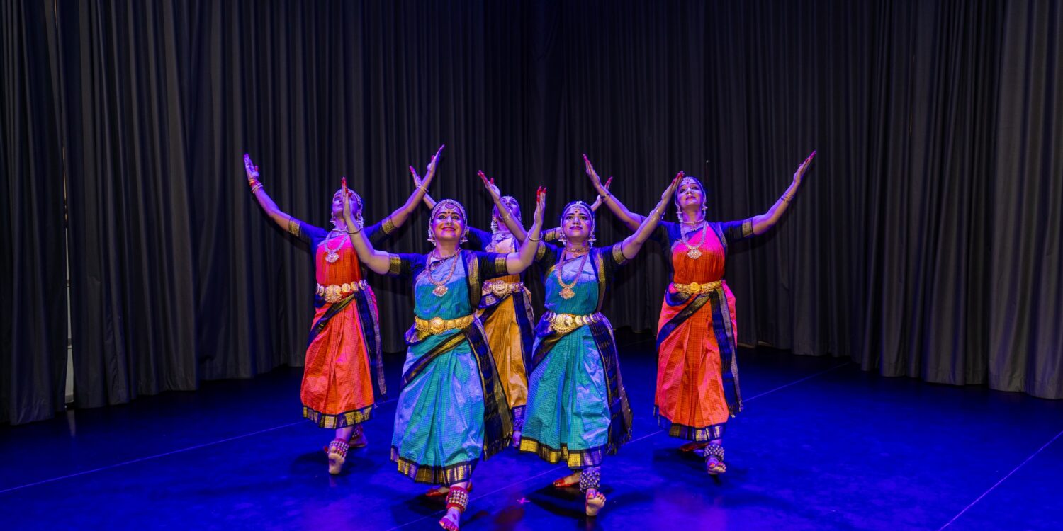 Bharatanatyam dancers in colourful costumes perform on stage at SIFAS Singapore Indian Fine Arts Society