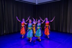 Bharatanatyam dancers in colourful costumes perform on stage at SIFAS Singapore Indian Fine Arts Society