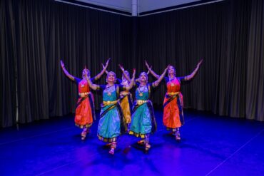 Bharatanatyam dancers in colourful costumes perform on stage at SIFAS Singapore Indian Fine Arts Society