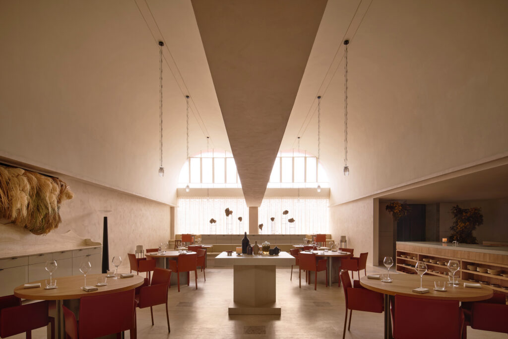 Dining room with high ceilings and arched windows at Somma, an Italian fine dining restaurant in Singapore