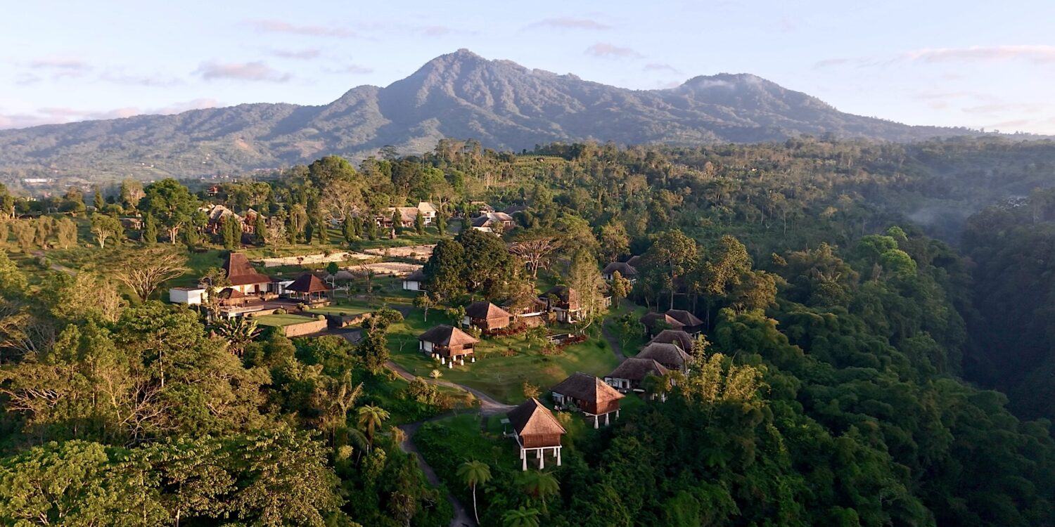 Aerial view of Bagus Agro Pelaga's highland eco-farm and thatched-roof villas in Bali, the venue for KAJE 2026.