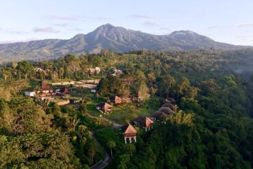 Aerial view of Bagus Agro Pelaga's highland eco-farm and thatched-roof villas in Bali, the venue for KAJE 2026.