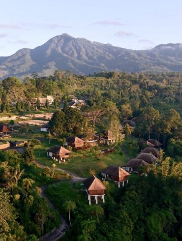 Aerial view of Bagus Agro Pelaga's highland eco-farm and thatched-roof villas in Bali, the venue for KAJE 2026.