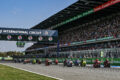 MotoGP riders take the start at Chang International Circuit in Buriram, Thailand, with a packed grandstand behind