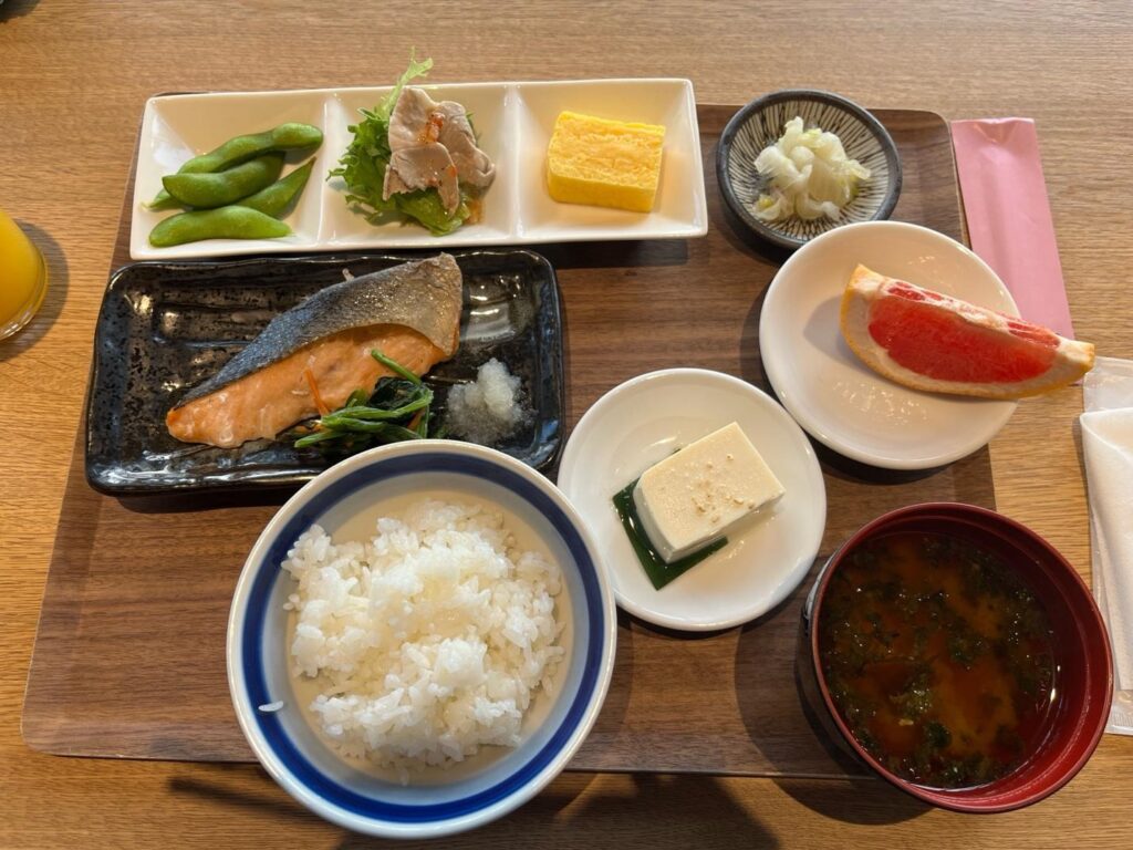 Japanese-style breakfast set at Fenix Furano with grilled salmon, rice, tofu, and miso soup