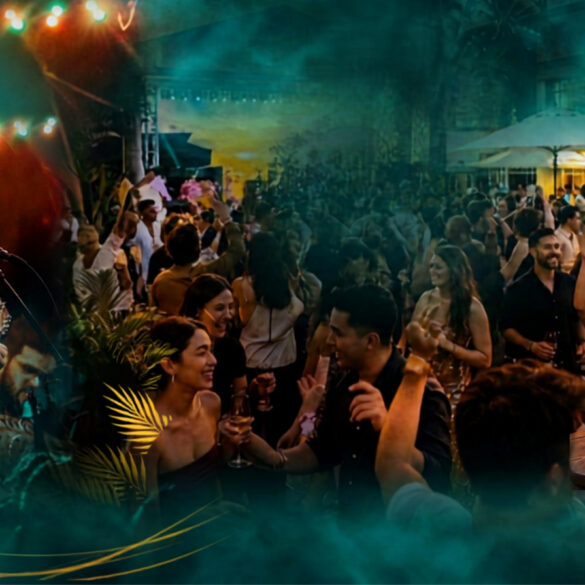 Live band performing and crowd dancing at Good Times Festival's outdoor terrace at South Beach Singapore, with a sharing platter in the foreground.
