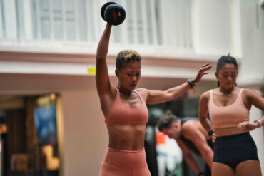 Two women compete in the outdoor run event at UFIT Games, Singapore's new partner-based fitness competition