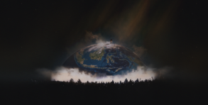 Silhouette of YE atop a glowing globe stage, with a crowd gathered below at YE Live in Jakarta 2026.