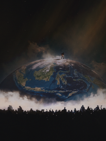 Silhouette of YE atop a glowing globe stage, with a crowd gathered below at YE Live in Jakarta 2026.