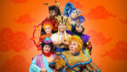 Cast of Wild Rice’s Monkey Goes West in costume as Ah Tang, the Monkey King, Pigsy, Sandy, Red Boy, King Bull and Princess Iron Fan against an orange cloud backdrop