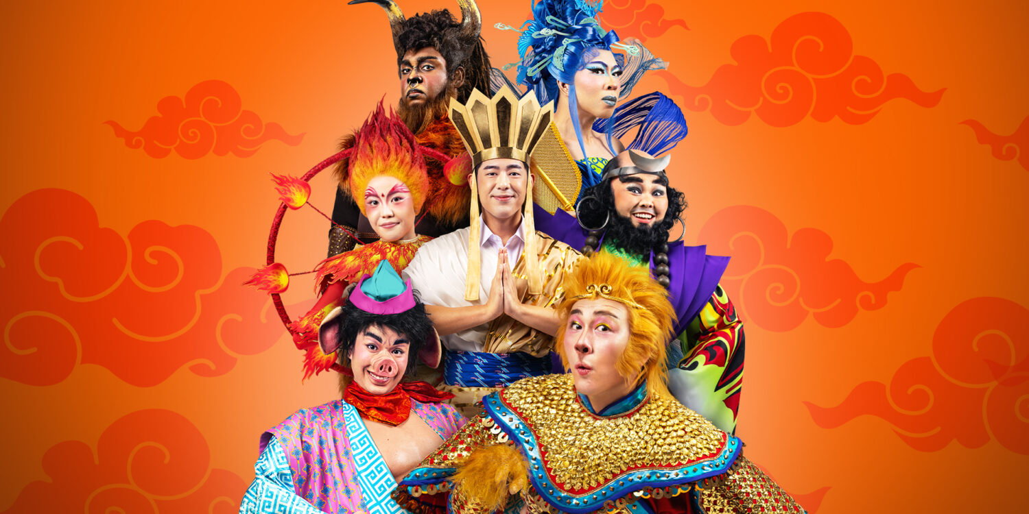 Cast of Wild Rice’s Monkey Goes West in costume as Ah Tang, the Monkey King, Pigsy, Sandy, Red Boy, King Bull and Princess Iron Fan against an orange cloud backdrop