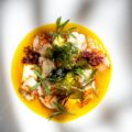 Seared langoustines with pineapple, crisp seaweed and fresh herbs in a golden yellow sauce, for new restaurants in Singapore September 2026.
