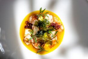 Seared langoustines with pineapple, crisp seaweed and fresh herbs in a golden yellow sauce, for new restaurants in Singapore September 2026.
